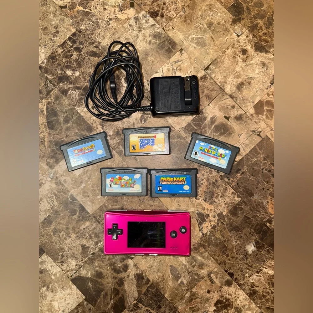 Pink Handheld Nintendo gameboy Micro with 5 games Mario Yoshi charger